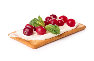 Tasty cracker with cheese and cranberry on white background