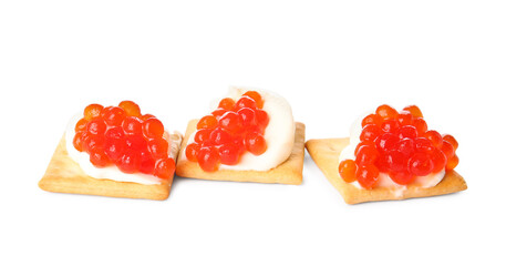Tasty crackers with cheese and red caviar on white background