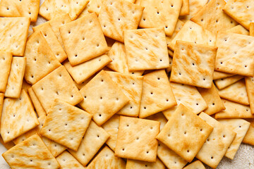 Tasty crackers as background, closeup