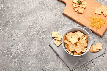 Composition with tasty crackers on grunge background