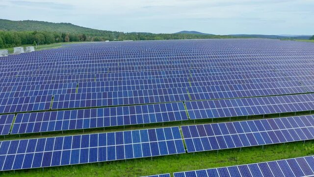 Solar generation by converting sunlight into electricity. The using of solar energy to meet the needs of farms. Photovoltaic devices, top view. High quality. 4k footage.