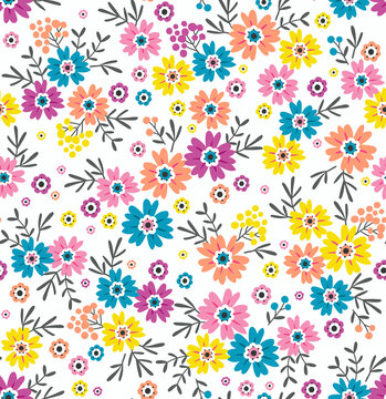 Cute floral pattern. Seamless vector pattern. Elegant template for fashion prints. Small colorful flowers for print. White background. Stock vector. © ann_and_pen