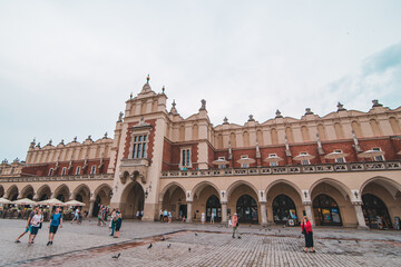 Obraz premium Krakow, Poland - June 16, 2019: building at market square of european city travel concept