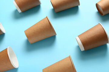 Takeaway cups for coffee on color background