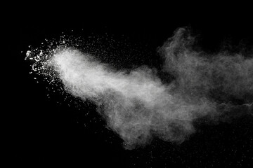 Naklejka premium White dust particles splashing. Freez motion of talcum powder burst in dark background.