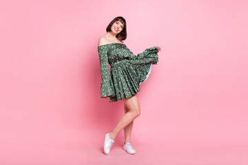 Full length body size view of attractive cheerful girl posing enjoying event occasion isolated over pink pastel color background