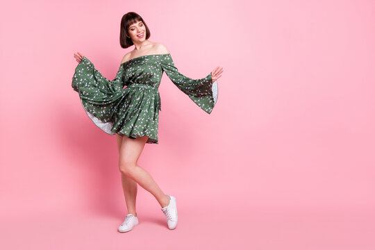 Full length body size view of attractive dreamy cheerful girl posing dancing isolated over pink pastel color background