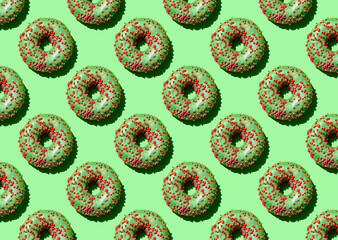Green donut is a seamless pattern on a green background.