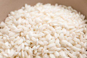Bowl with raw rice, closeup