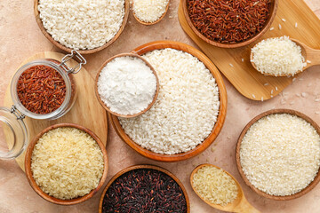Different types of raw rice and flour on color background