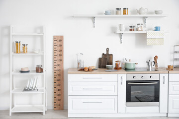 Interior of modern kitchen with stadiometer