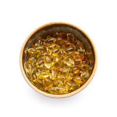 Bowl with fish oil capsules on white background