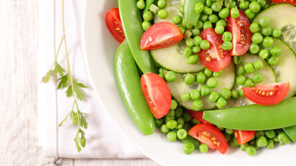 vegetable salad with pea,  bean, cucumber and tomato