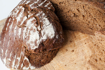 black rye bread divided into parts, fresh and soft