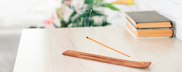 incense sticks on incense stands are on the table, an addition to the interior, meditation