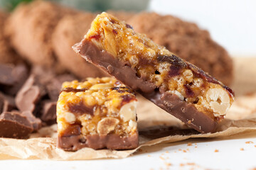 nuts, air rice, chocolate and other ingredients in a chocolate bar