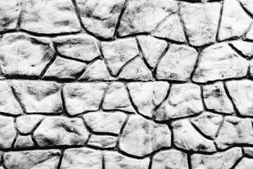 Texture of a brick wall with cracks and scratches which can be used as a background