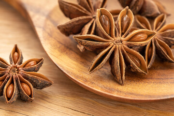 Star anise on wooden spoon. Cooking Spice