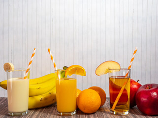 Orange, banana and apple cocktail.