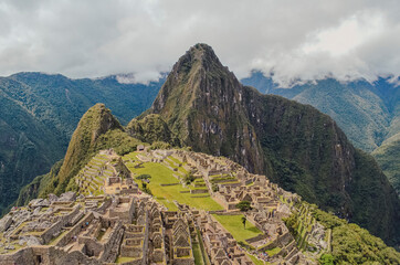 View of Machu Picchu lost city with Huayna Picchu mountain. Ruins of ancient inca civilization in the sacred valley of Cusco Province. Peru, South America