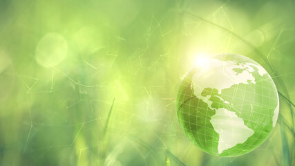 Concept ecology earth globe on green sunny blurred copy space background.