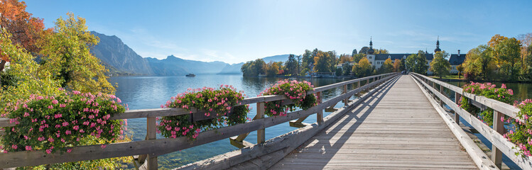 tourist destination Gmunden, lake Traunsee, bridge to Ort island, beautiful flower decoration