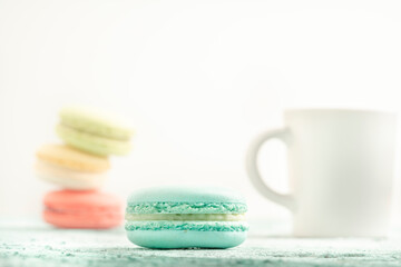 colorful macaroons and coffee on table with copy space