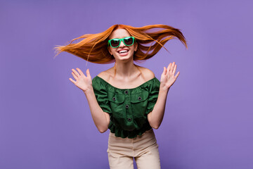 Photo of impressed pretty young woman dressed off-shoulders blouse dancing smiling isolated violet color background