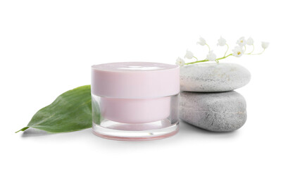 Jar of cream, stones and lily-of-the-valley flowers on white background