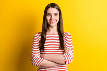 Portrait of attractive glad content cheerful girl folded arms good mood isolated over bright yellow color background