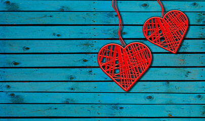Two Hearts On Rustic Wood Blue Background. Heart Shape made By red thread hang with ropes in wooden wall, Original Love Concept 