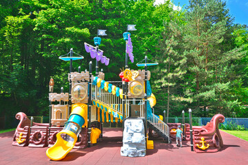 Children playground equipment in the form of pirate ship in the park.