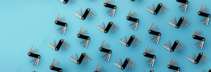 Pattern of bicycle repair tools on blue background.