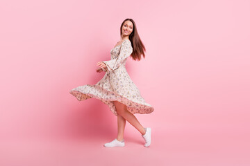 Full length body size photo pretty girl dancing in spring wearing floral dress isolated pastel pink...
