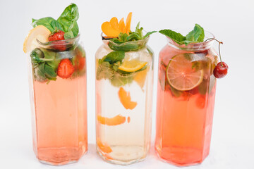 set with different fruits cocktails on white background