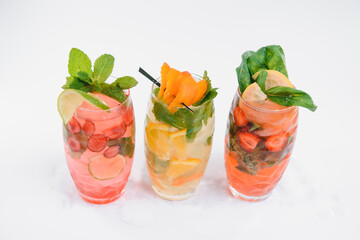 set with different fruits cocktails on white background