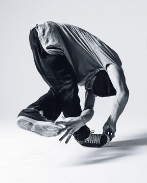 Young beautiful cool looking bboy posing in studio
