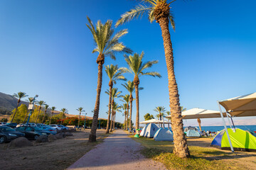 kineret-israel. 18-06-2021. Tents of hikers on the shores of the Sea of Galilee at sunrise, on Korsi beach