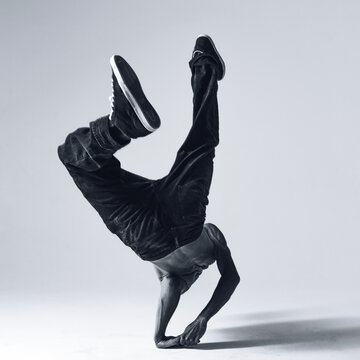 Young beautiful cool looking bboy posing in studio
