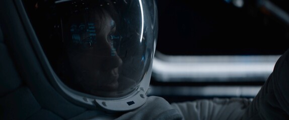 Portrait of Caucasian female astronaut inside spaceship cockpit. Sci-fi space exploration concept. Moon mission © supamotion