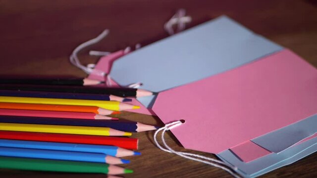 Pencils and address label tags on a table