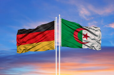 Algeria and Germany two flags on flagpoles and blue sky