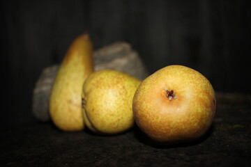 pears on a black background