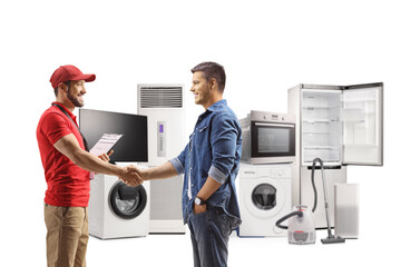 Shop assistant from an electircal appliances store shaking hands with a customer
