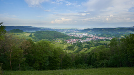 Fototapeta premium Landscape of a town (Donzdorf) in the valley of the Swabian Alb. Green trees and meadow. Germany, Goppingen.