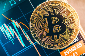 Bitcoin trading on the stock exchange, bar chart on the smartphone, cryptocurrency symbol
