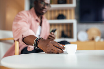 Picture of a cup, filled with warm coffee.