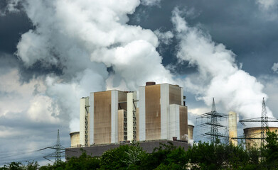 Fototapeta na wymiar Coal Power plant with lots of smoke in the sky