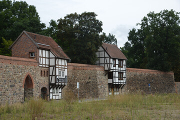 Side view of historic Wiek houses in the town of Neubrandenburg, Germany on a gloomy day