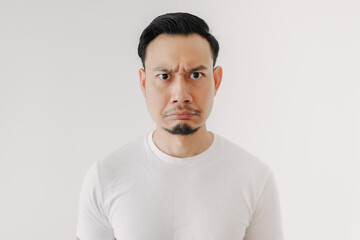 Grumpy face Asian man in white t-shirt isolated on white background.